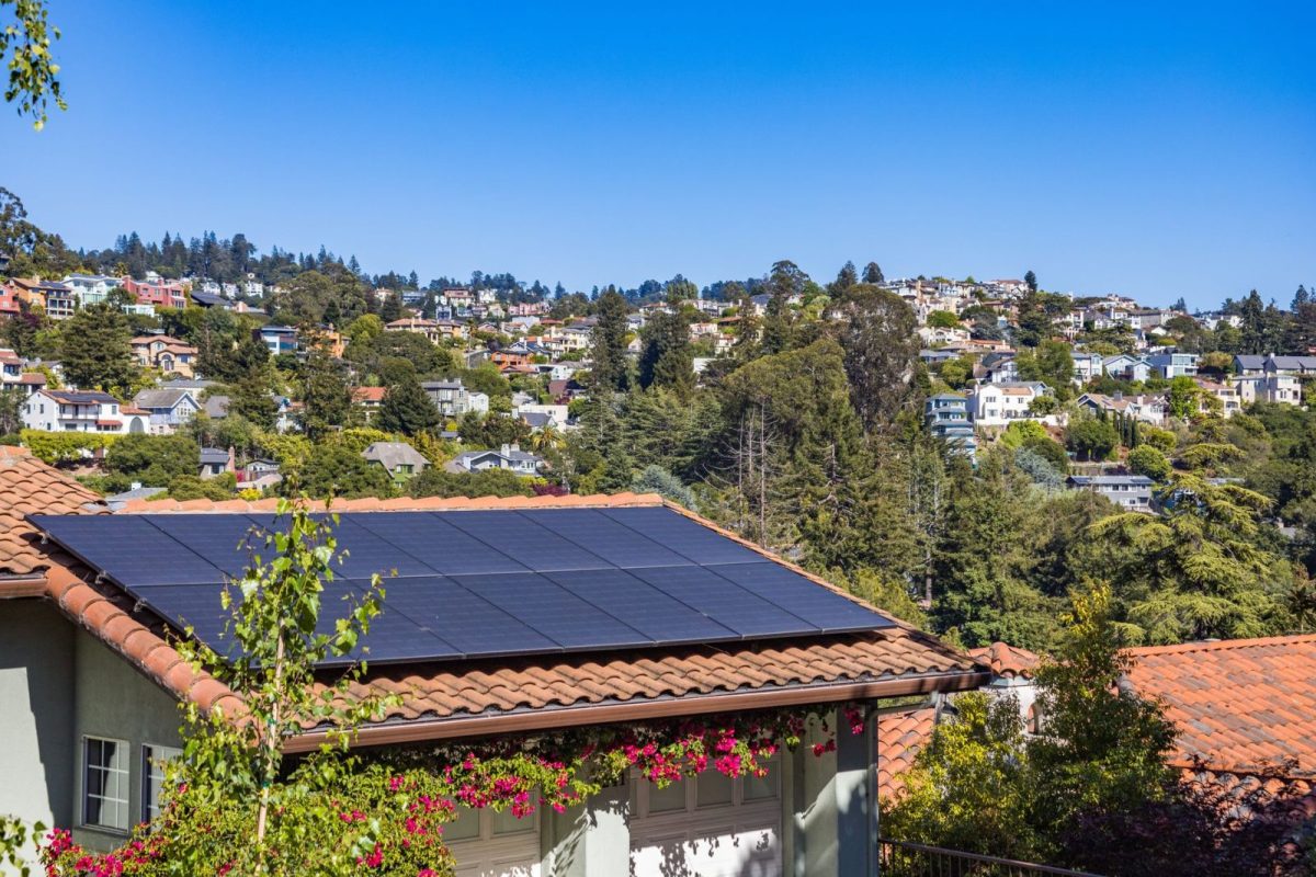 Rooftop solar panel array feeding a home inverter