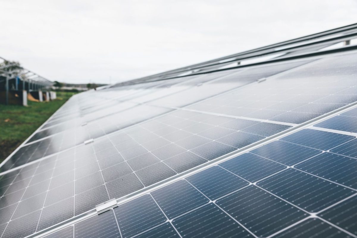 Close-up of a black monocrystalline solar panel on a rooftop