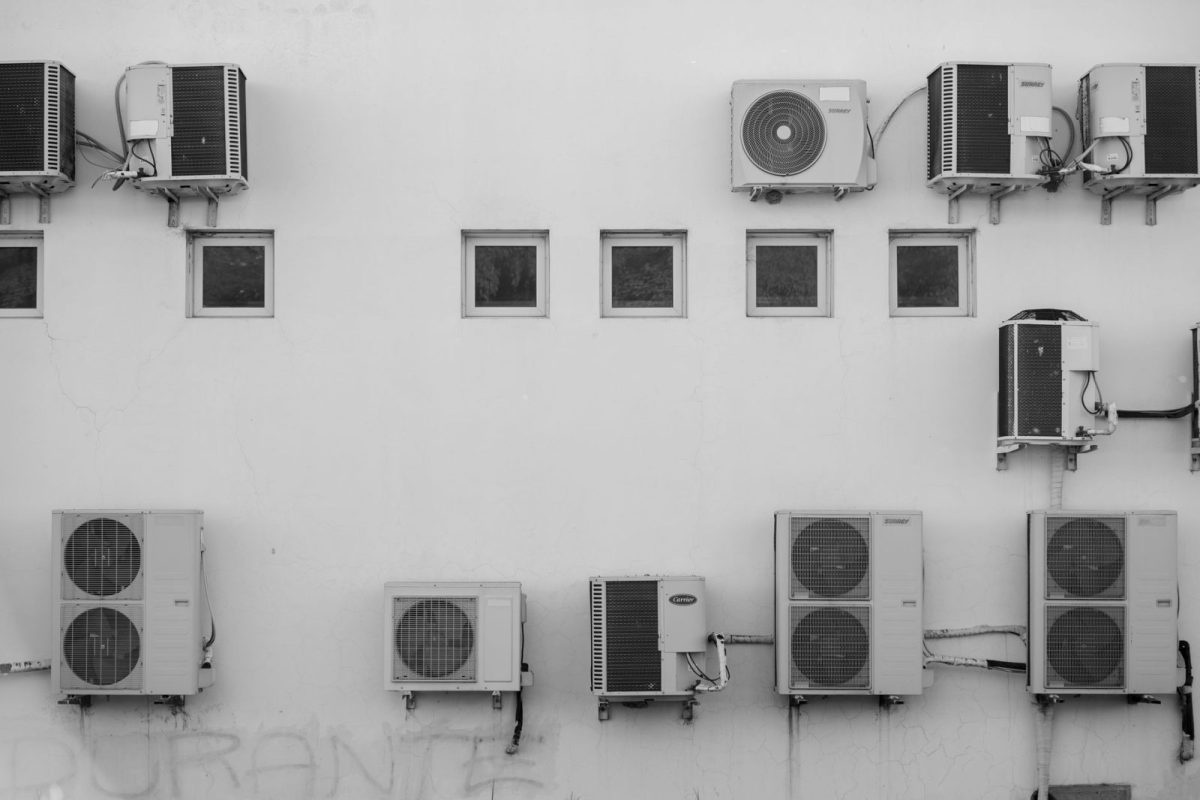Solar inverter mounted outdoors on an exterior wall exposed to weather