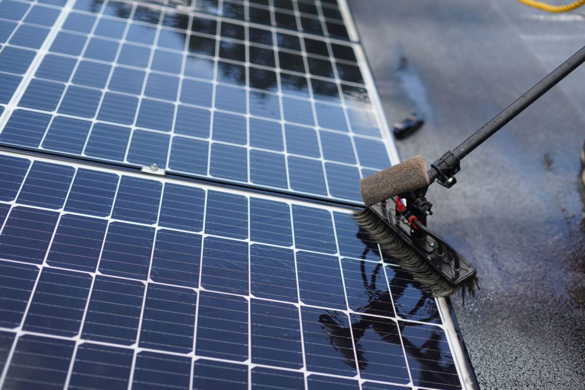Solar panels mounted on a residential rooftop under clear sky