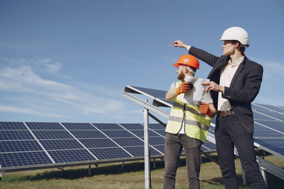 Ground-mounted solar panel array on a metal frame in an open field