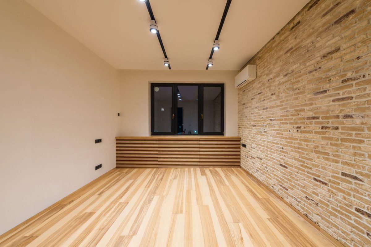Wall-mounted home solar battery storage unit in a ventilated space