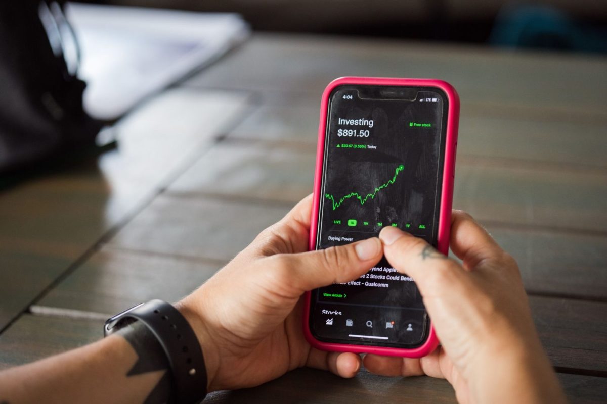 Homeowner checking solar production data on a monitoring app dashboard