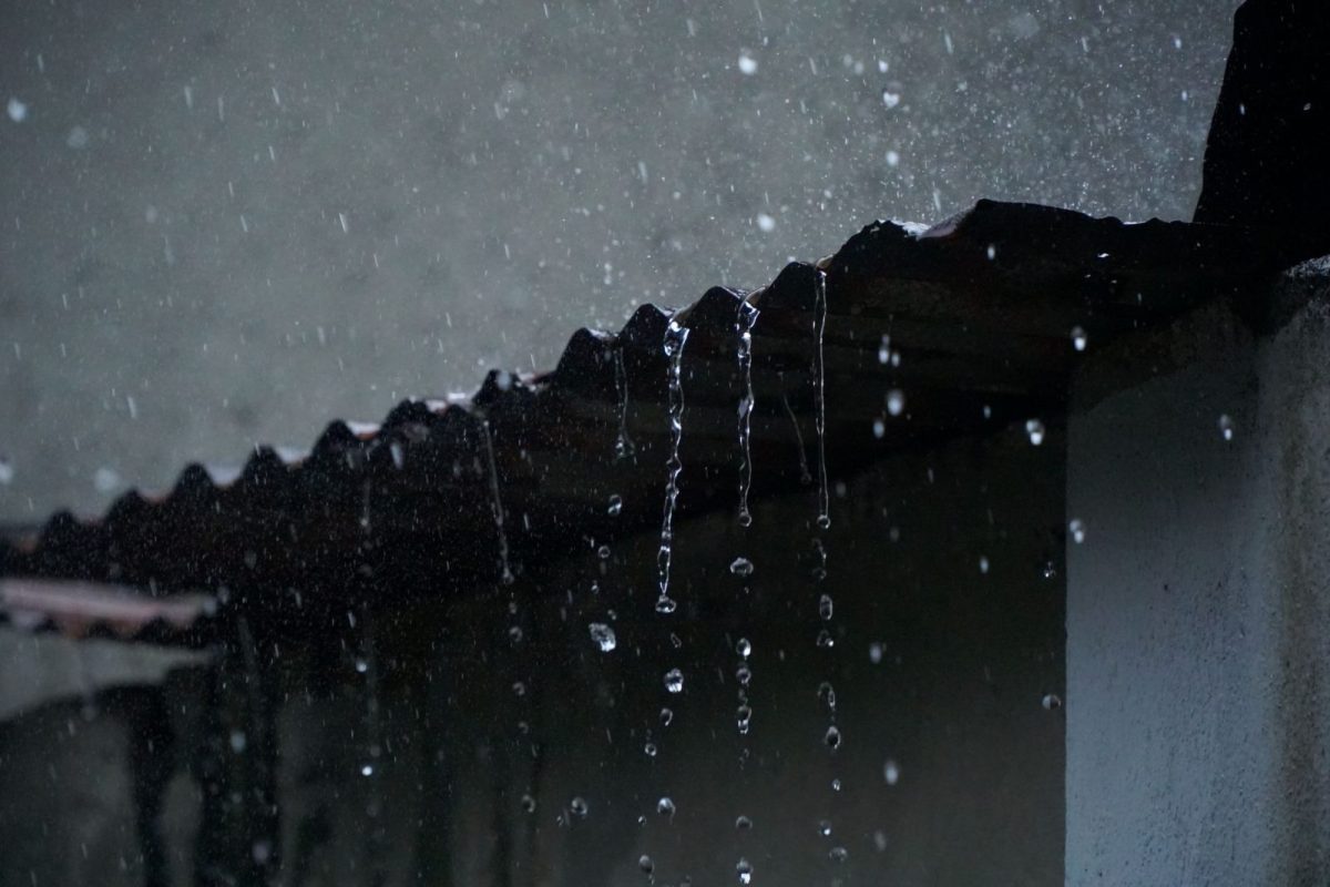 Rooftop solar panels being rinsed by heavy monsoon rain in India
