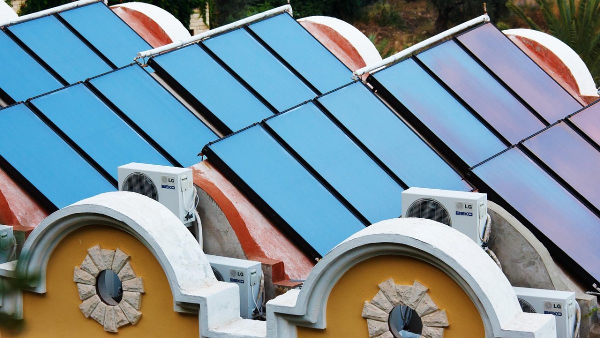 Rooftop solar panel array under clear sky