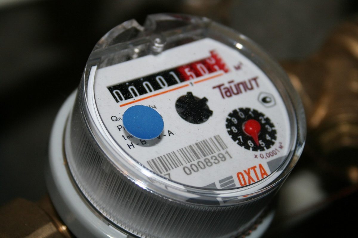 Technician checking grid voltage at the meter and connection point
