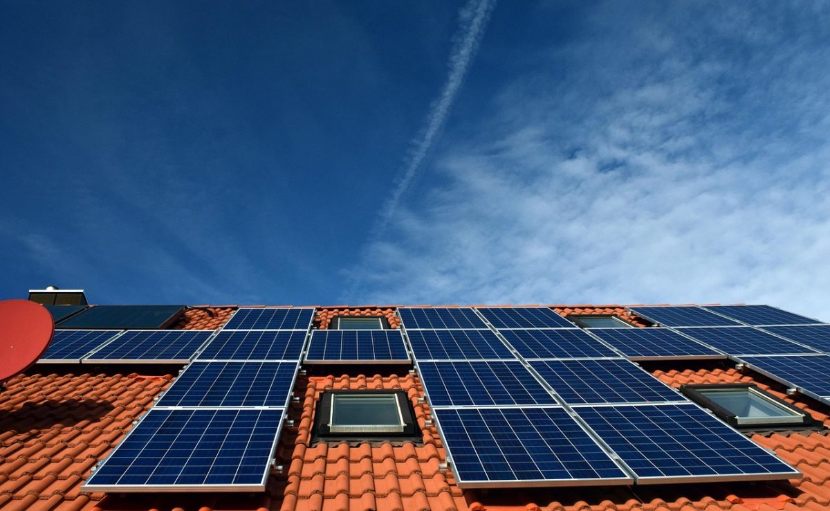 Solar panel array installed on a reflective rooftop surface