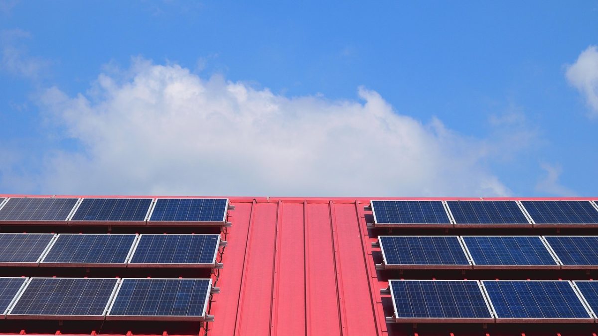 Rooftop solar panel array under a clear sky