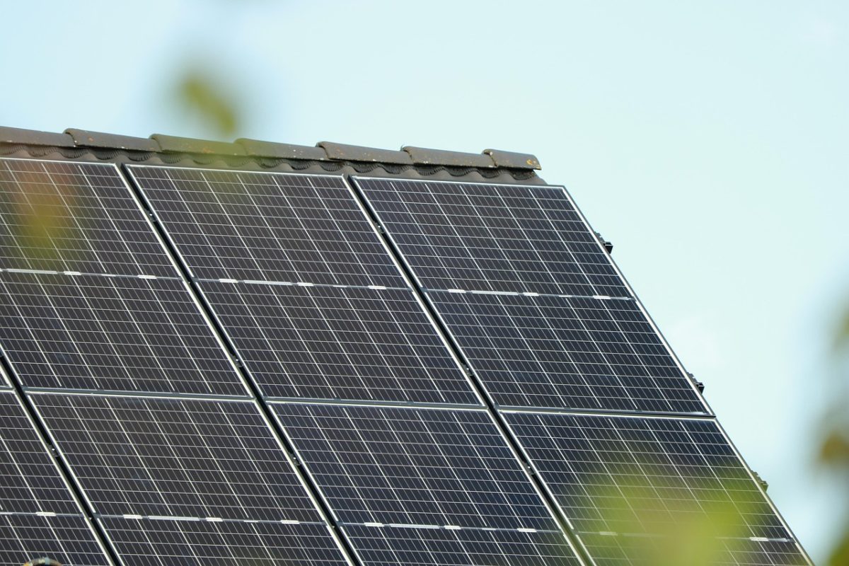 Rooftop solar panels feeding a grid-tied inverter system