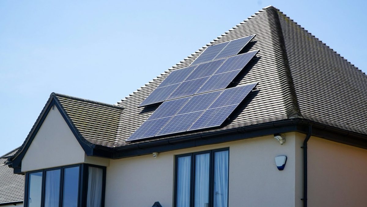 Rooftop solar array being inspected during annual maintenance