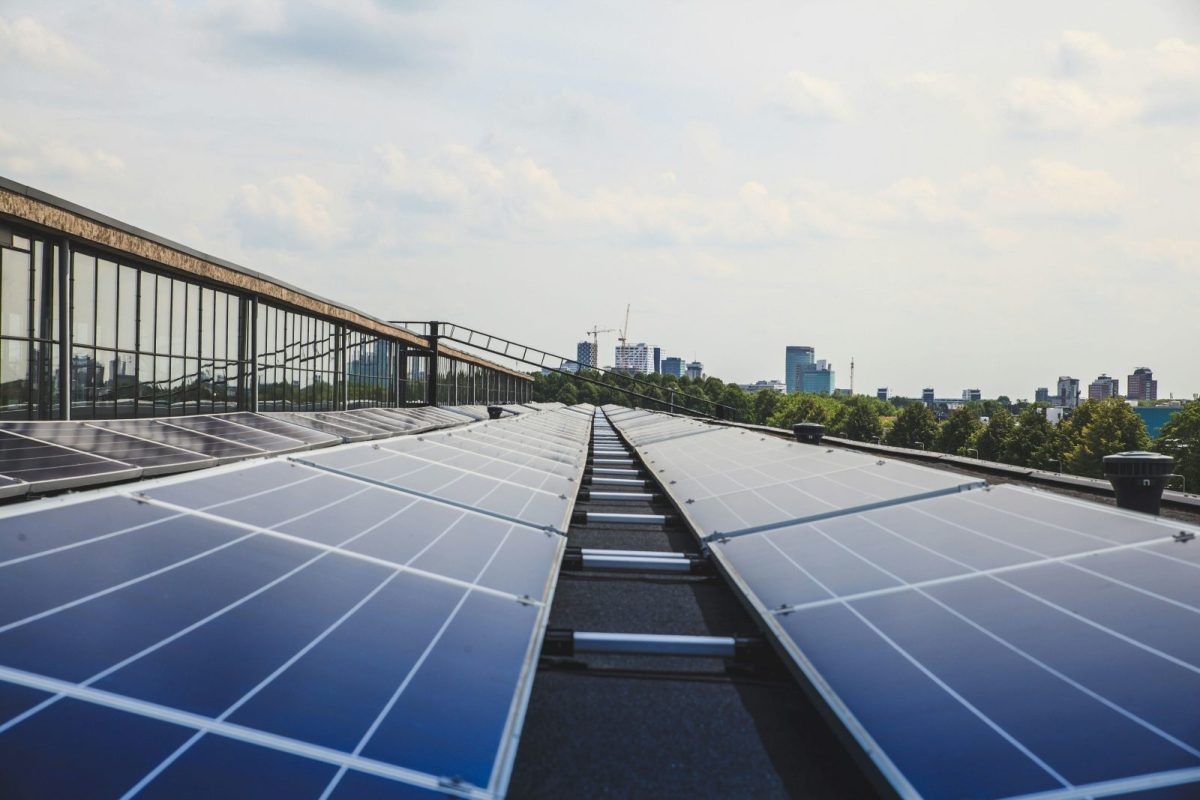 Rooftop solar panels being cleaned during routine maintenance