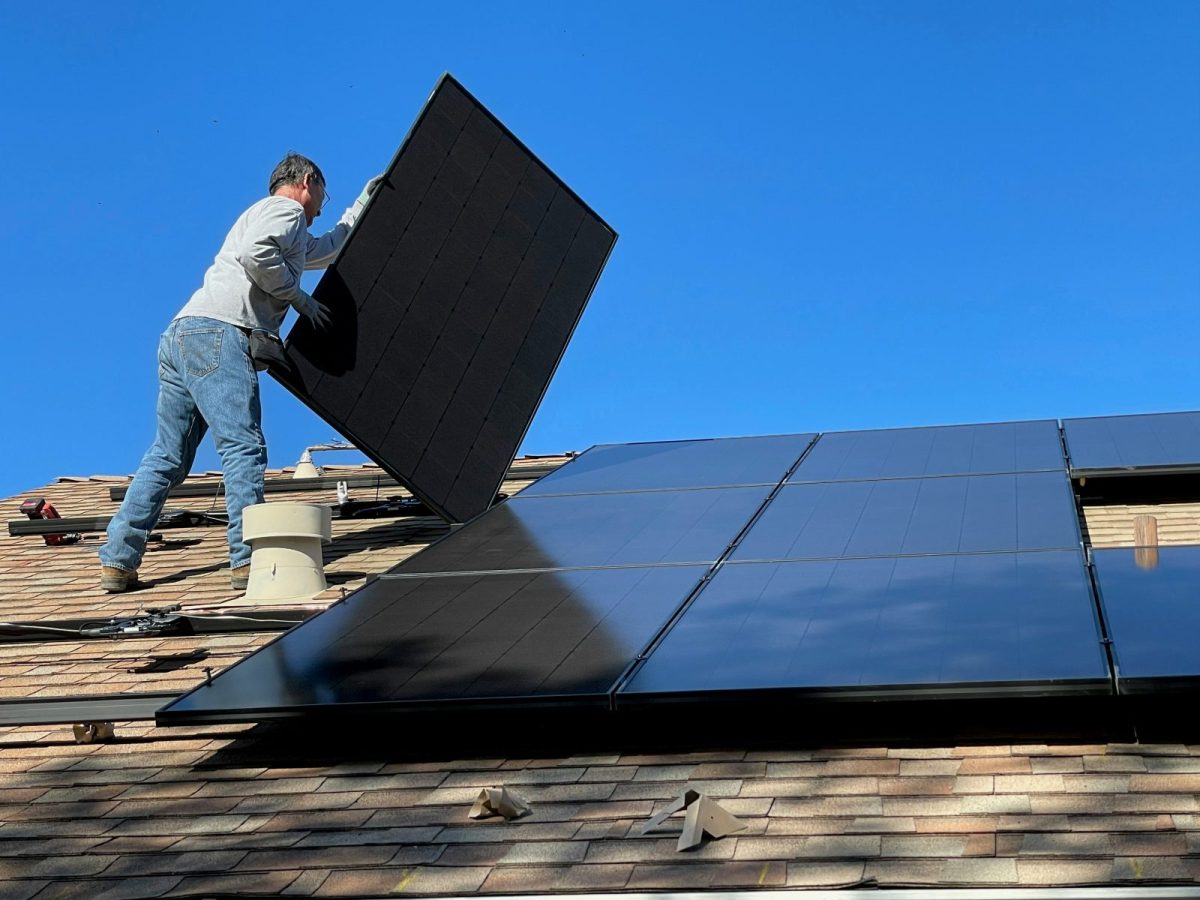 Rooftop solar array with visible dust and grime before cleaning